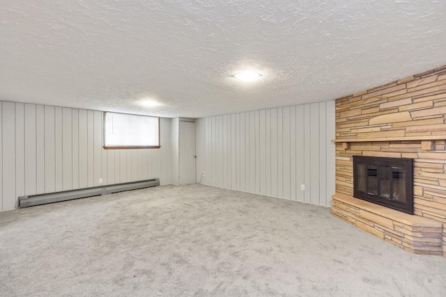 4922 Sheridan Ave S, Minneapolis, MN 55410 - unfurnished living room with a baseboard heating unit, a stone fireplace, carpet, a textured ceiling, and wood walls