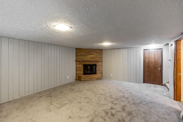 4922 Sheridan Ave S, Minneapolis, MN 55410 - unfurnished living room with a fireplace, carpet, a textured ceiling, and wood walls