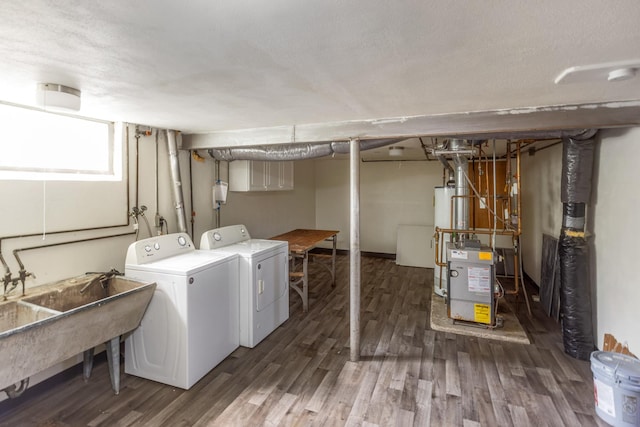 4922 Sheridan Ave S, Minneapolis, MN 55410 - laundry area featuring independent washer and dryer, wood finished floors, water heater, and a heating unit