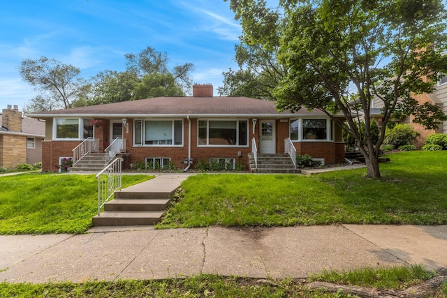 4922 Sheridan Ave S, Minneapolis, MN 55410 - ranch-style home with brick siding, a front lawn, and a chimney