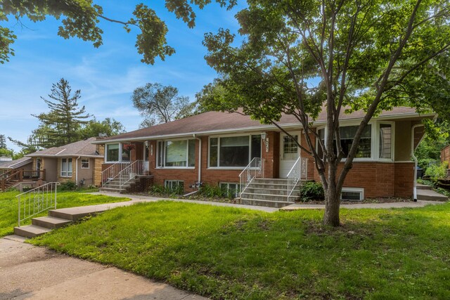 4922 Sheridan Ave S, Minneapolis, MN 55410 - single story home with brick siding and a front lawn