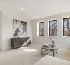 living area with carpet flooring and recessed lighting