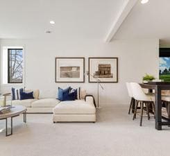 carpeted living area with recessed lighting