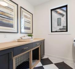 bathroom with vanity, tile patterned floors, and baseboards