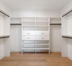 spacious closet with light wood-style flooring
