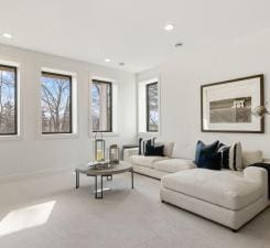 carpeted living area featuring recessed lighting
