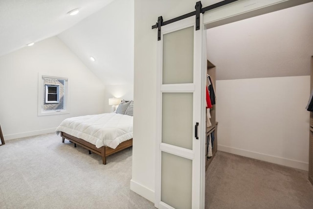 1372 Victoria St N, Saint Paul, MN 55117 - bedroom with carpet flooring, vaulted ceiling, baseboards, and a barn door