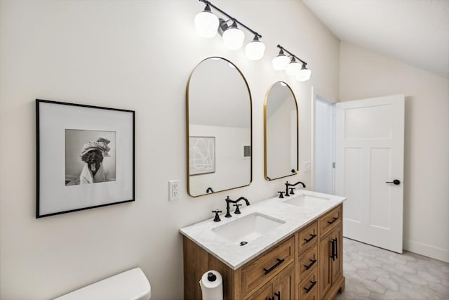 1372 Victoria St N, Saint Paul, MN 55117 - full bathroom featuring double vanity, vaulted ceiling, and toilet