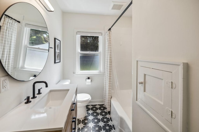 1372 Victoria St N, Saint Paul, MN 55117 - bathroom with toilet, vanity, tile patterned floors, and shower / bath combination with curtain