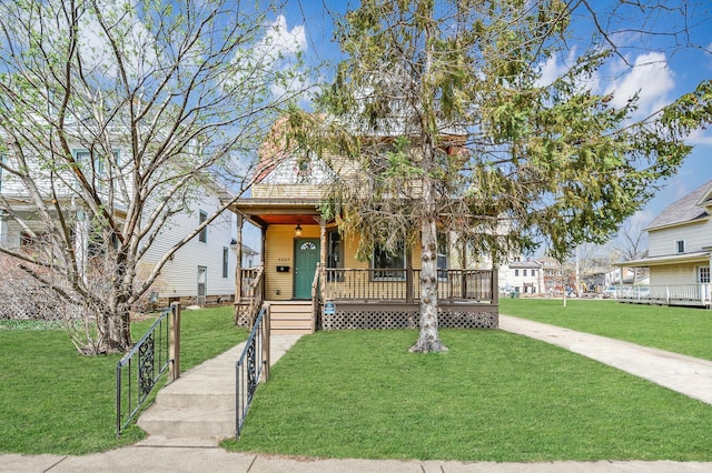 1527 Minnehaha Ave W, Saint Paul, MN 55104 - shotgun-style home with covered porch and a front lawn