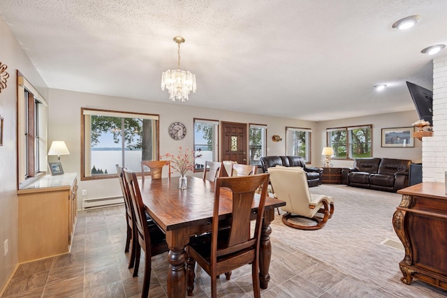 3886 Eagle Rd, Willmar, MN 56201 - dining room with a baseboard heating unit, a chandelier, and a textured ceiling