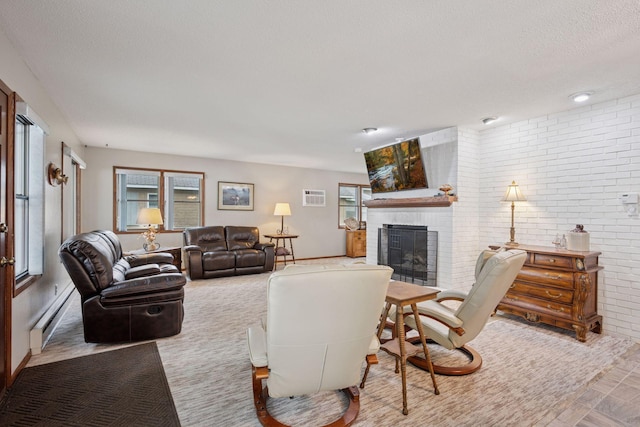 3886 Eagle Rd, Willmar, MN 56201 - living room with brick wall, a fireplace, a baseboard heating unit, a textured ceiling, and a wall mounted AC