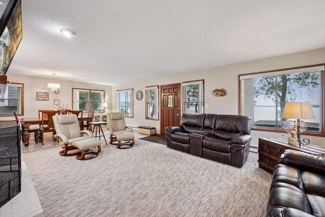 3886 Eagle Rd, Willmar, MN 56201 - carpeted living area featuring a chandelier and a baseboard heating unit