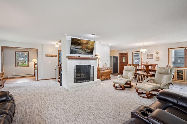 3886 Eagle Rd, Willmar, MN 56201 - living area with baseboard heating, a fireplace, a chandelier, and light carpet