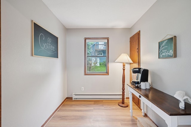 3886 Eagle Rd, Willmar, MN 56201 - office space with a baseboard heating unit and light wood-type flooring