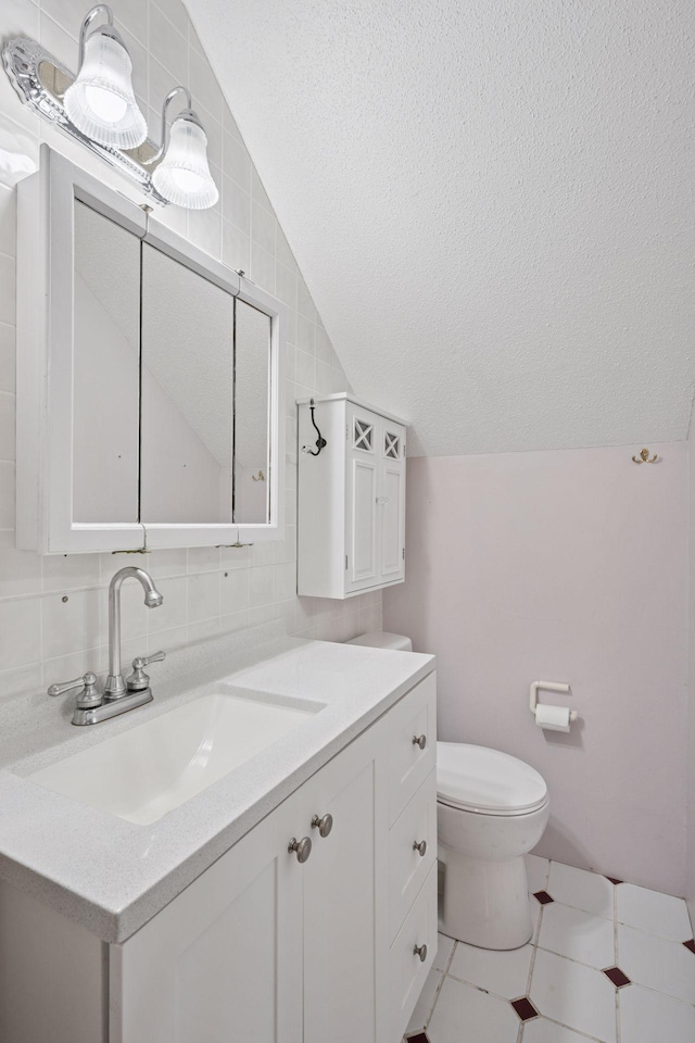 3886 Eagle Rd, Willmar, MN 56201 - half bathroom featuring vaulted ceiling, vanity, a textured ceiling, and tasteful backsplash