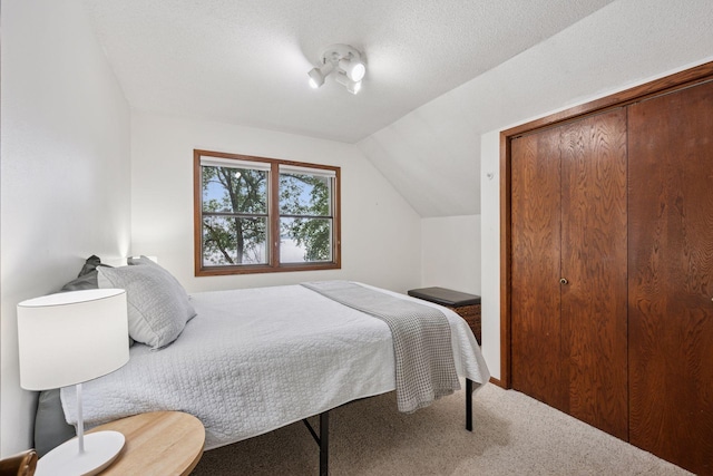 3886 Eagle Rd, Willmar, MN 56201 - carpeted bedroom with lofted ceiling and a closet