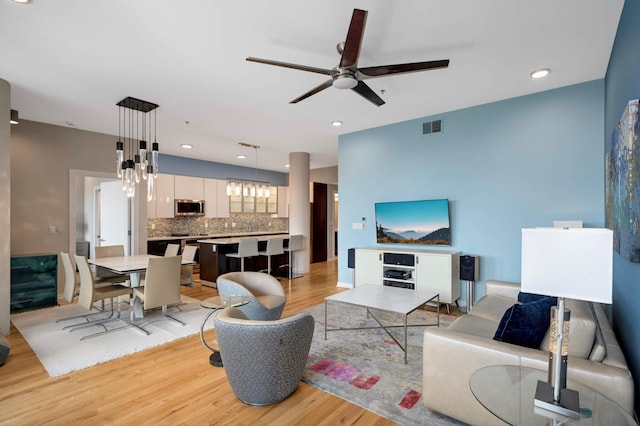 1240 2nd St Unit 1120, Minneapolis, MN 55415 - living room with ceiling fan, light wood finished floors, and recessed lighting