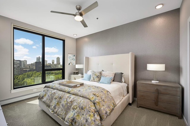 1240 2nd St Unit 1120, Minneapolis, MN 55415 - bedroom featuring a baseboard heating unit, carpet, a ceiling fan, recessed lighting, and baseboards