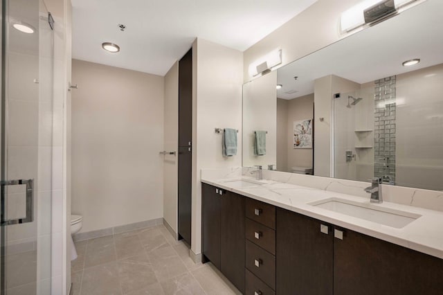 1240 2nd St Unit 1120, Minneapolis, MN 55415 - full bathroom with toilet, a stall shower, double vanity, and baseboards