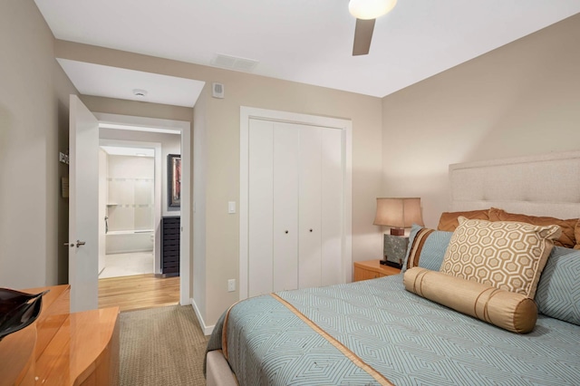 1240 2nd St Unit 1120, Minneapolis, MN 55415 - carpeted bedroom featuring a closet, a ceiling fan, and baseboards