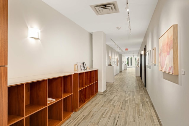 1240 2nd St Unit 1120, Minneapolis, MN 55415 - hallway featuring rail lighting and light wood-style flooring