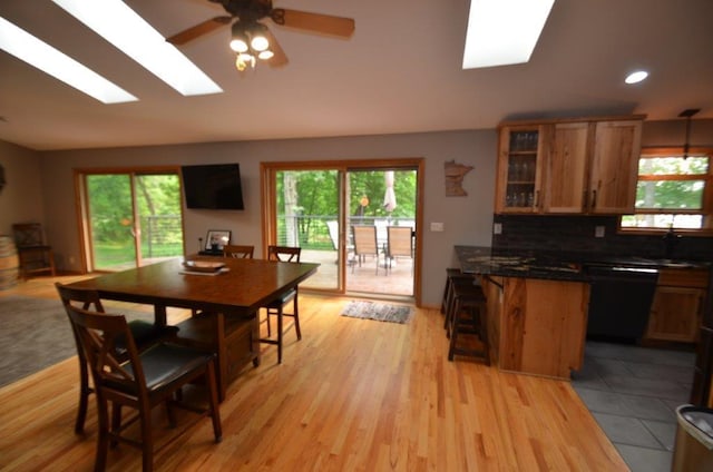 12207 285th St, Lindstrom, MN 55045 - dining space with a skylight, a ceiling fan, recessed lighting, and light wood-style floors