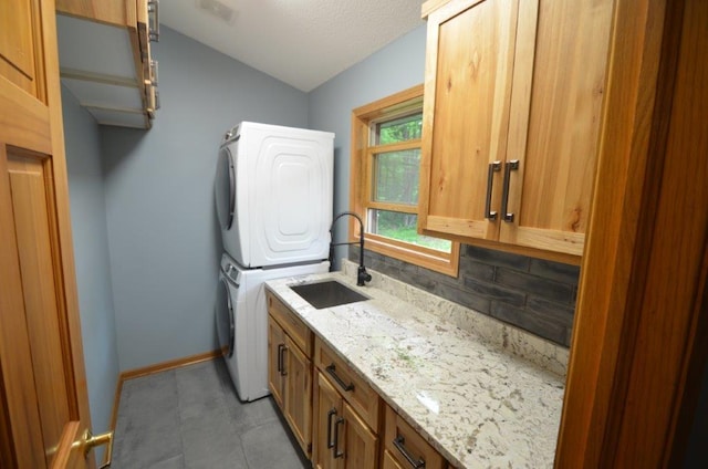 12207 285th St, Lindstrom, MN 55045 - washroom with cabinet space and stacked washer / dryer