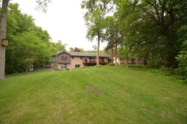 12207 285th St, Lindstrom, MN 55045 - view of green lawn with a deck