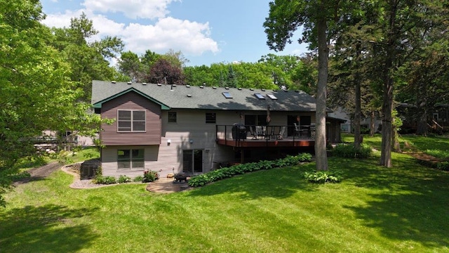 12207 285th St, Lindstrom, MN 55045 - rear view of property featuring a yard, a wooden deck, and a patio