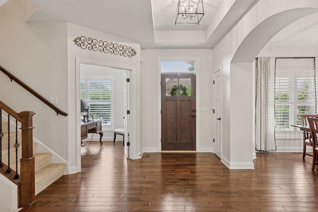 11668 Azure Ct, Inver Grove Heights, MN 55077 - entrance foyer with dark wood-style floors, stairs, and arched walkways