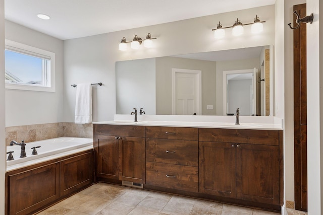 11668 Azure Ct, Inver Grove Heights, MN 55077 - full bath featuring double vanity, a garden tub, and tile patterned flooring