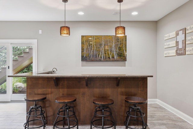 11668 Azure Ct, Inver Grove Heights, MN 55077 - indoor bar featuring light wood-style flooring, hanging light fixtures, and recessed lighting