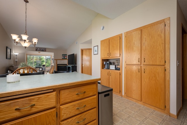 812 Plum Tree Ln, Somerset, WI 54025 - kitchen with refrigerator, light flooring, a chandelier, lofted ceiling, and open floor plan