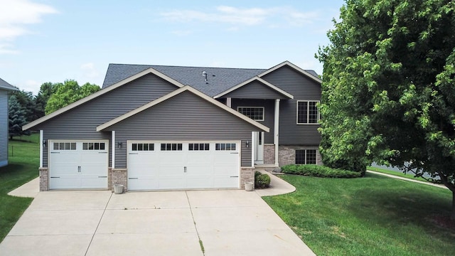 1406 English Ave NW, New Prague, MN 56071 - view of front of property featuring a front yard, driveway, an attached garage, and brick siding