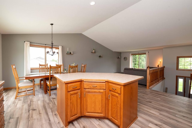 1406 English Ave NW, New Prague, MN 56071 - kitchen with lofted ceiling, light wood-style flooring, plenty of natural light, light countertops, and recessed lighting