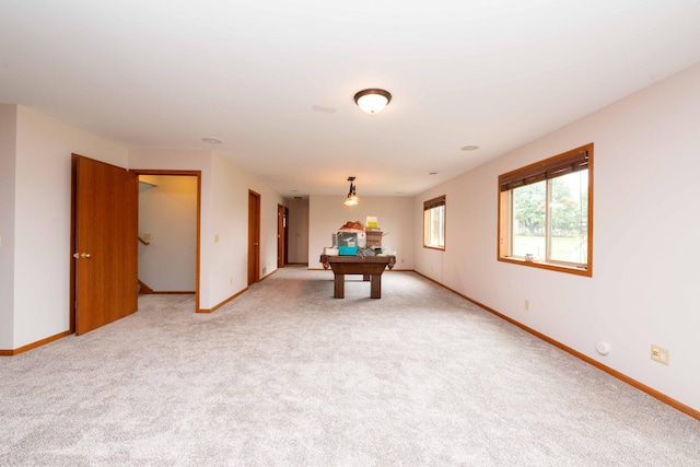 1406 English Ave NW, New Prague, MN 56071 - game room with baseboards and light colored carpet