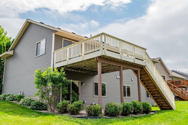 1406 English Ave NW, New Prague, MN 56071 - back of house with stairway, a deck, and a yard