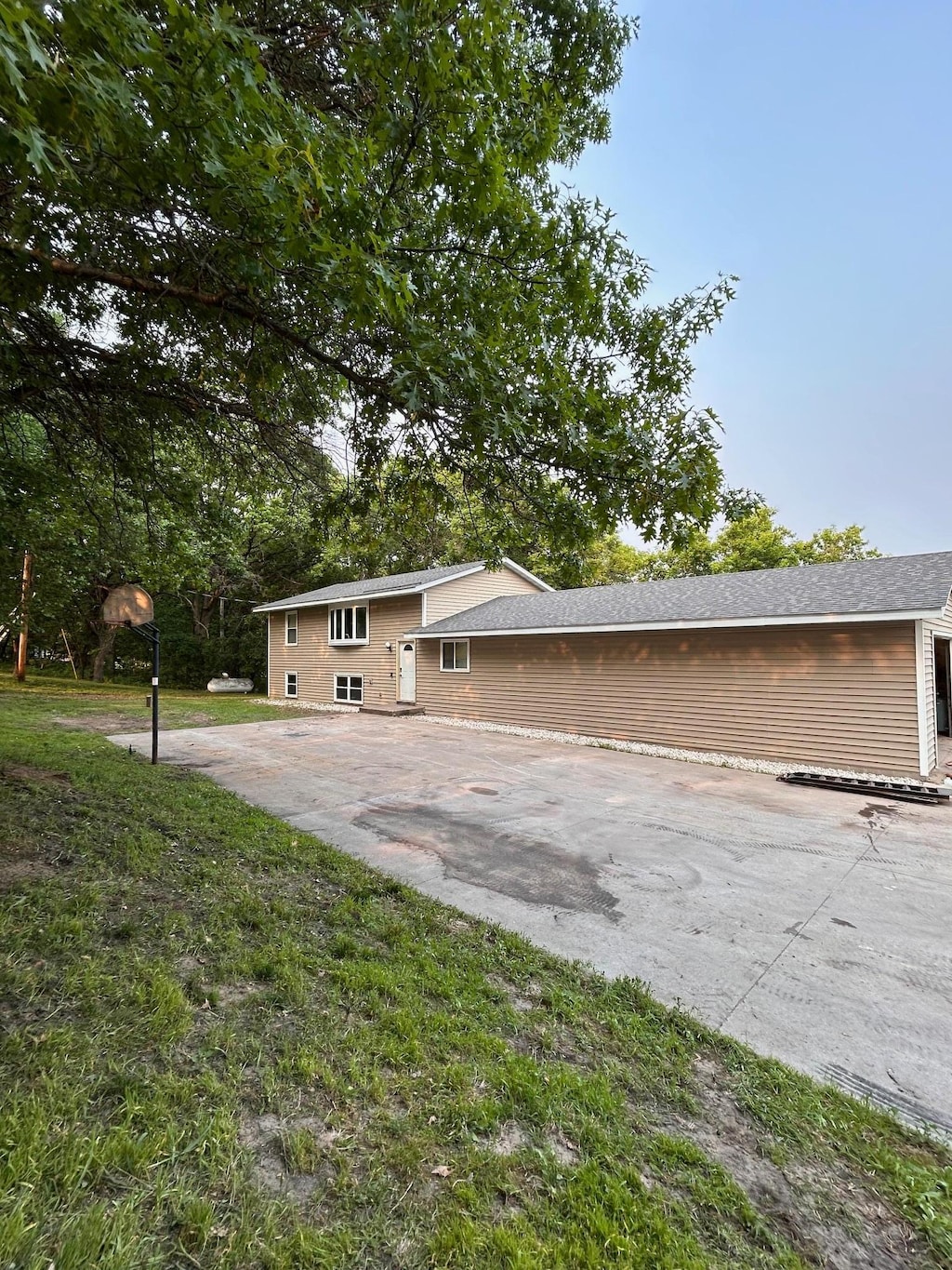 24927 Narcissus St NW, Isanti, MN 55040 - view of side of property with a patio area
