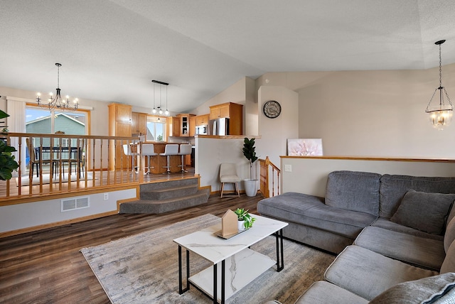 7331 Lamont Ave NE, Otsego, MN 55301 - living area featuring a chandelier, dark wood finished floors, and lofted ceiling