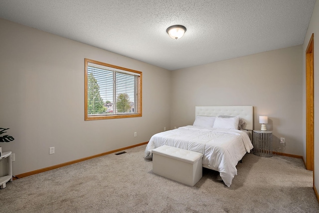 7331 Lamont Ave NE, Otsego, MN 55301 - carpeted bedroom featuring a textured ceiling and baseboards