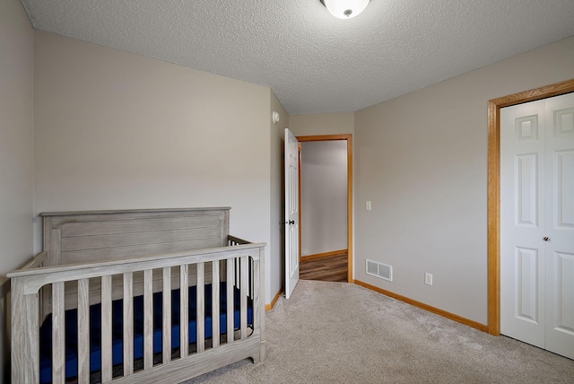 7331 Lamont Ave NE, Otsego, MN 55301 - unfurnished bedroom with carpet flooring and a textured ceiling
