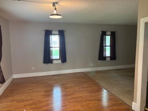 664 12th St, Windom, MN 56101 - empty room with wood finished floors and baseboards