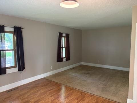 664 12th St, Windom, MN 56101 - empty room featuring baseboards and wood finished floors