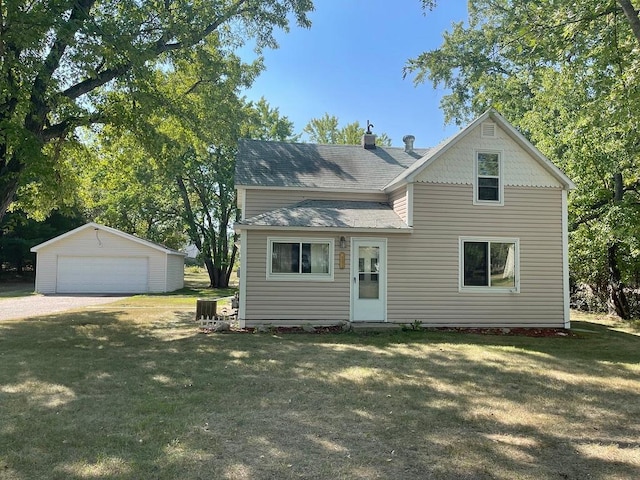 810 Charles St, Park Rapids, MN 56470 - view of front of property featuring a detached garage, an outdoor structure, a front yard, a shingled roof, and cooling unit