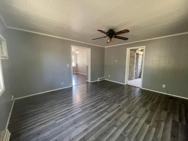 810 Charles St, Park Rapids, MN 56470 - empty room featuring ornamental molding, dark wood finished floors, ceiling fan, and baseboards