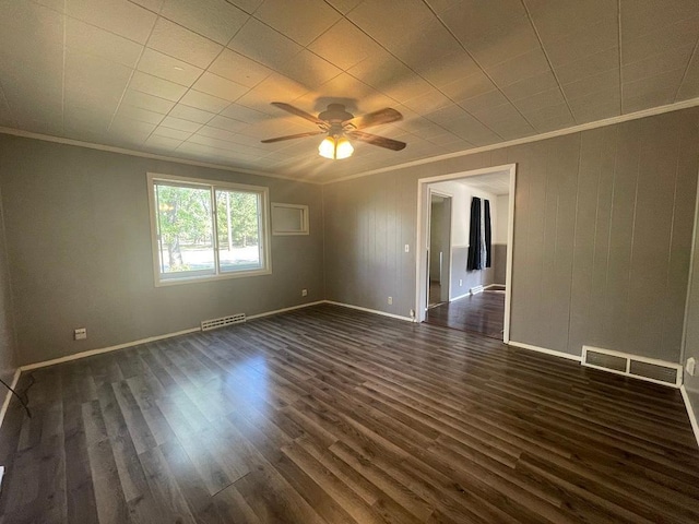 810 Charles St, Park Rapids, MN 56470 - spare room featuring ornamental molding, a ceiling fan, dark wood finished floors, and baseboards