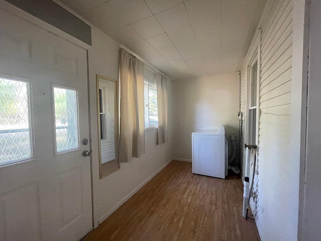 810 Charles St, Park Rapids, MN 56470 - laundry room with washer / clothes dryer, wood finished floors, and baseboards
