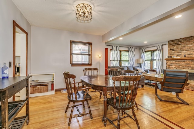 3807 Hubbard Ave N, Robbinsdale, MN 55422 - dining space featuring light wood-type flooring, a chandelier, recessed lighting, and baseboards