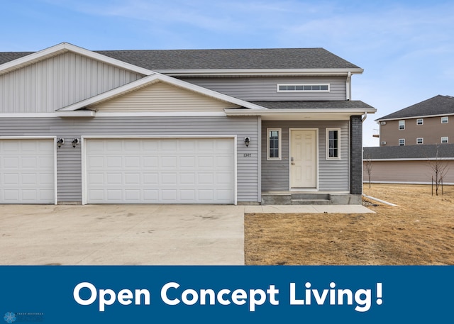 1347 13th St W, West Fargo, ND 58078 - view of front of home featuring driveway, a garage, and roof with shingles